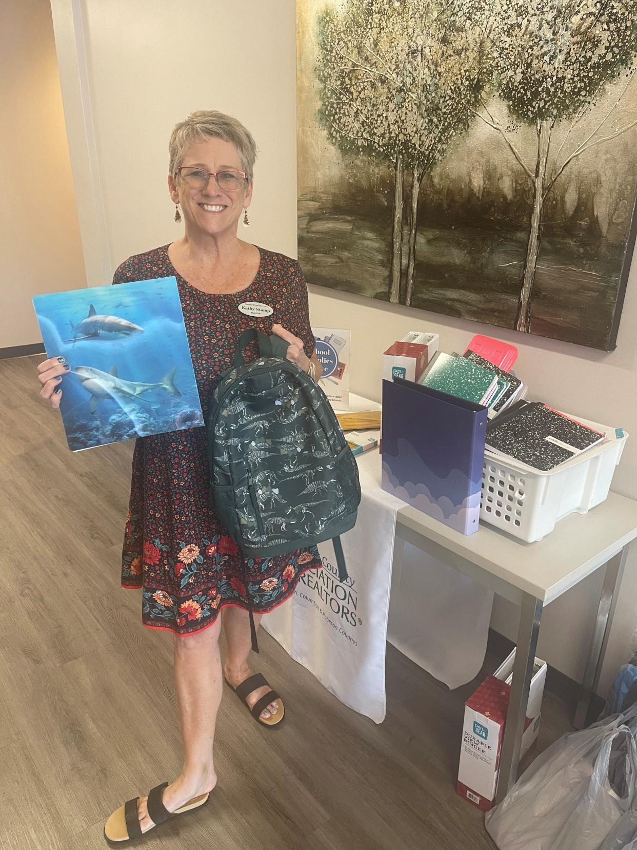 Kathy Stamp of Starheel Properties donated school supplies to the Brunswick County Association of Realtors Cares Task Force.