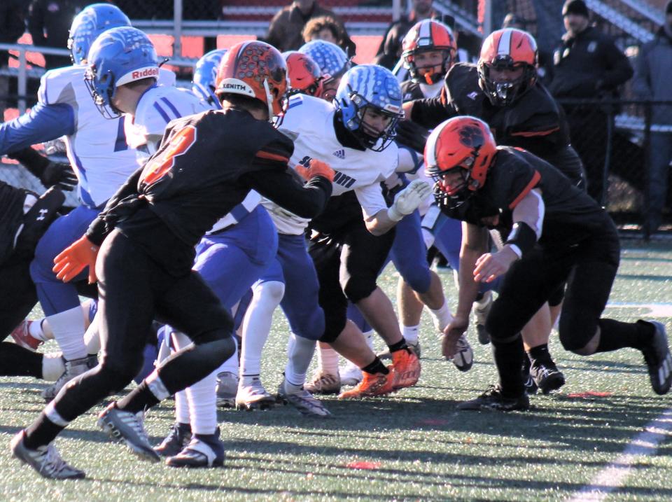 Somersworth's Kayden Bickford looks for running room during Saturday's Division IV championship game in Laconia.