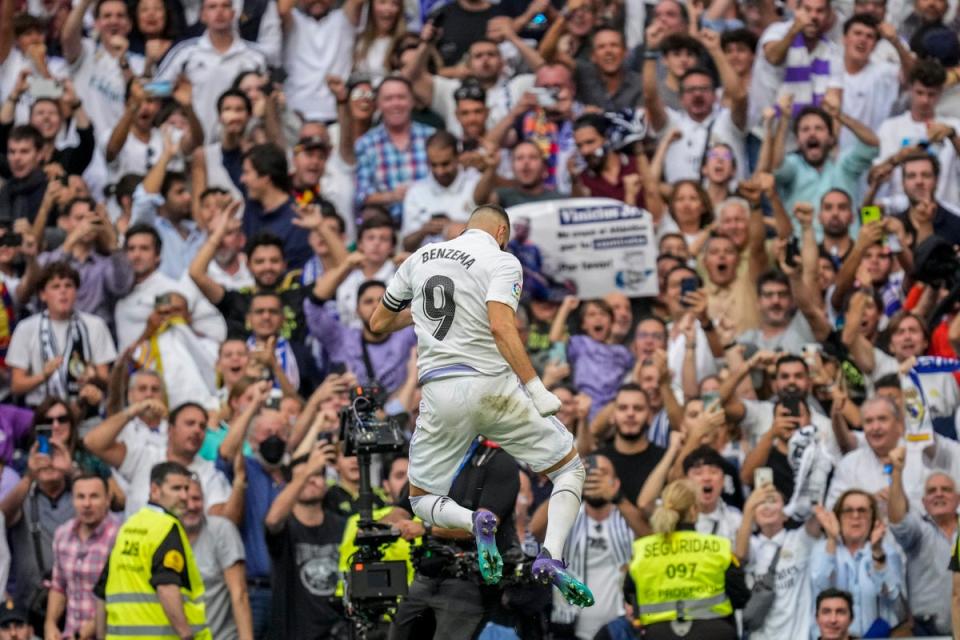 Real Madrid’s Karim Benzema celebrates after opening the scoring against Barcelona (Bernat Armangue/AP/PA) (AP)