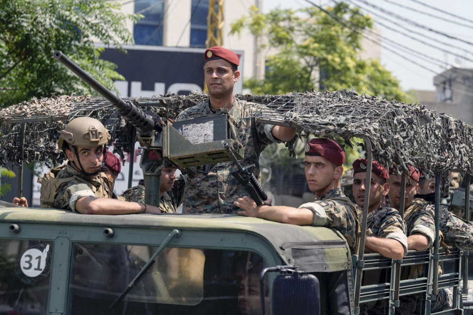 FILE - Lebanese special forces sit in their vehicle as they patrol on a road that leads to the U.S. Embassy in Aukar, a northern suburb of Beirut, Lebanon, June 5, 2024. On Tuesday, July 2, a judge at Lebanon's military court charged the gunmen who opened fire at the U.S. embassy near Beirut with being affiliated to the militant Islamic State group. (AP Photo/Bilal Hussein, File)