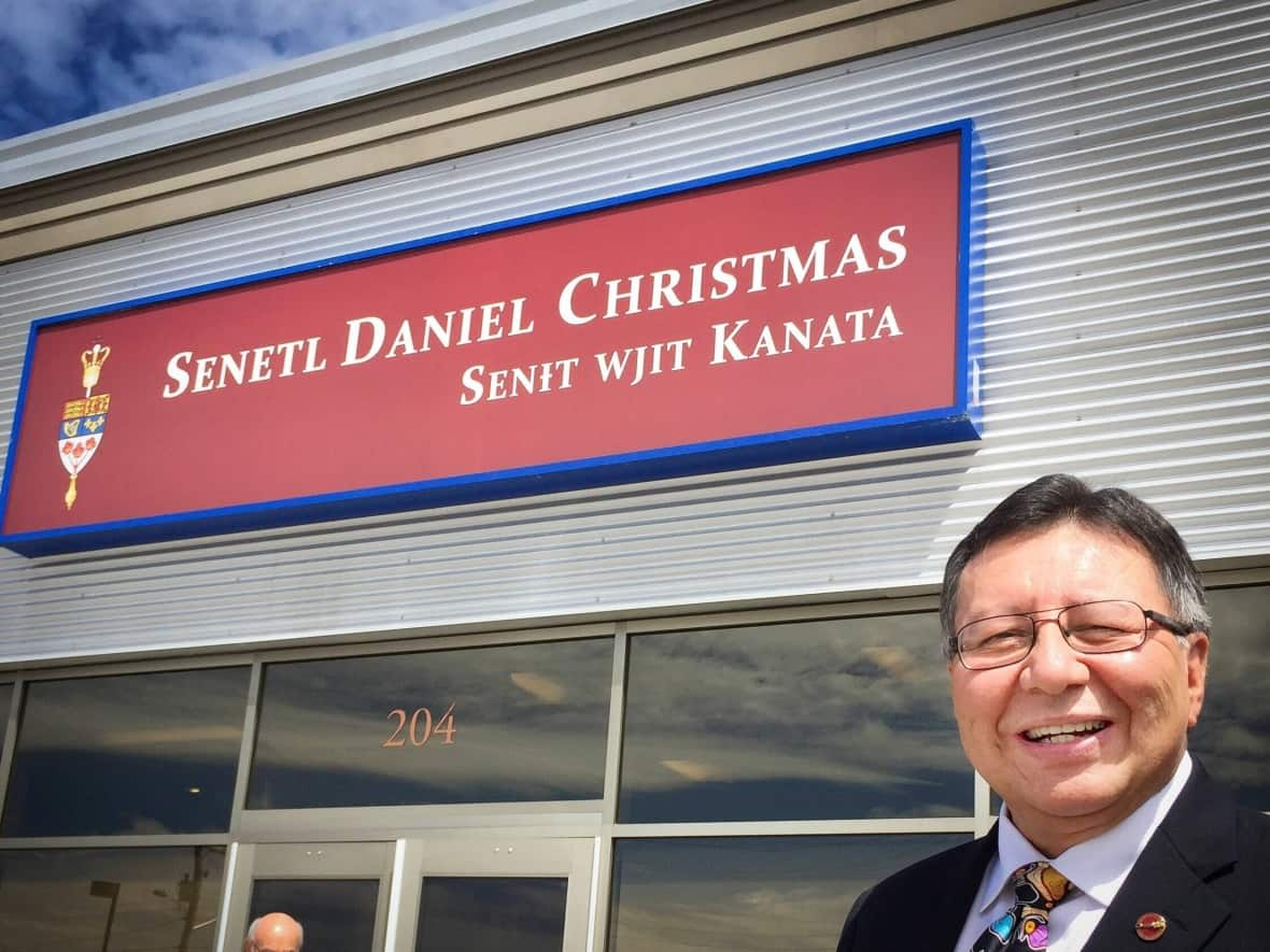 Dan Christmas, seen in front of his office in Membertou in 2018, has retired from the Canadian Senate to spend more time with his daughter. (Tom Ayers/CBC - image credit)