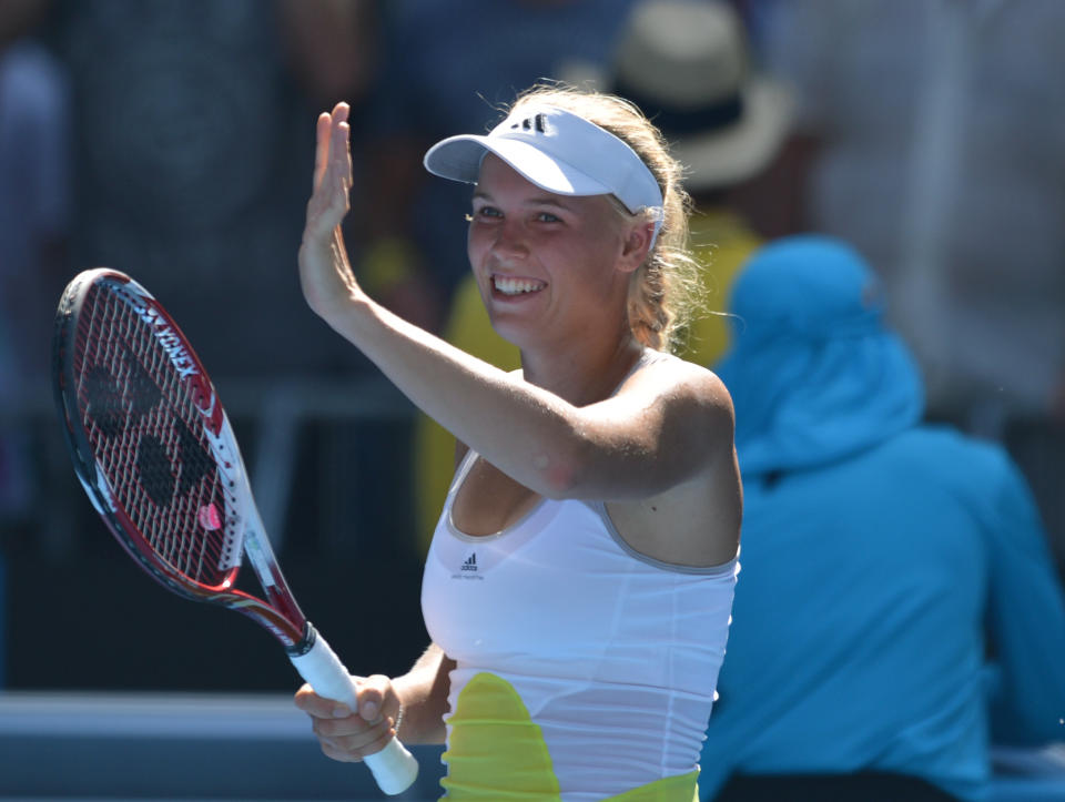 Denmark's Caroline Wozniacki celebrates after victory in her women's singles match against Donna Vekic of Croatia on the fourth day of the Australian Open tennis tournament in Melbourne on January 17, 2013. 