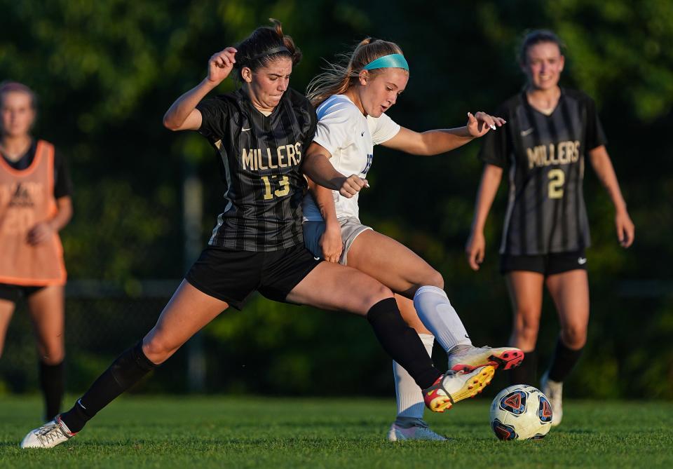 Noblesville Millers Marit McLaughlin (13) kicks the ball against Hamilton Southeastern Royals Cole Lance (3) on Saturday, August 27, 2022 at White River Elementary School in Noblesville. The Noblesville Millers defeated the Hamilton Southeastern Royals, 1-0. 