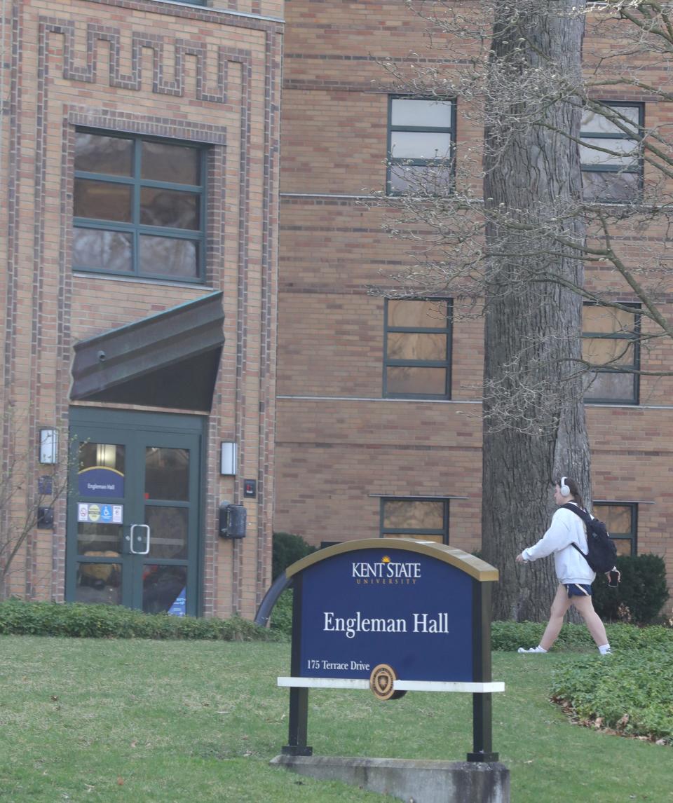 Kent State University students walk by Engleman Hall on March 12. The university will need to reduce spending with multimillion dollar spending cuts through fiscal year 2028.