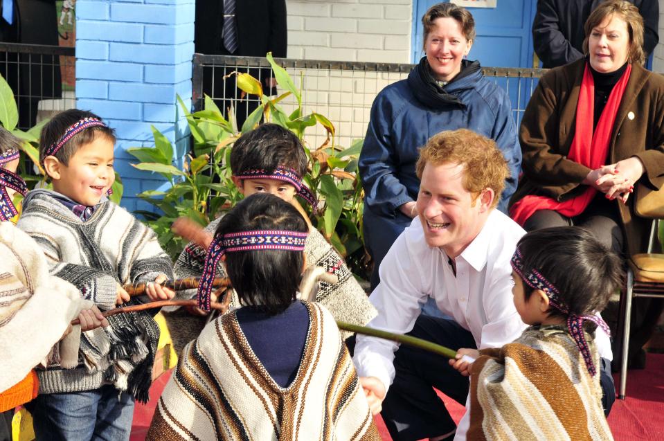 Britain's Prince Harry meets Mapuche children during a visit to Integra Foundation, a daycare center for at-risk children, in Santiago