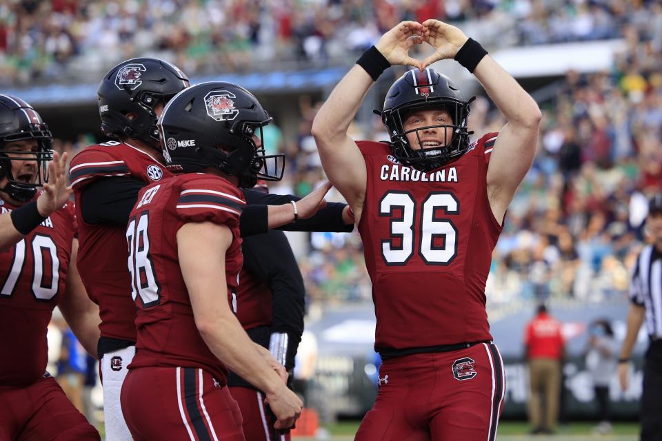 South Carolina Gamecocks long snapper Hunter Rogers (36) reacts to scoring a touchdown during the first quarter of the TaxSlayer Gator Bowl of an NCAA college football game Friday, Dec. 30, 2022 at TIAA Bank Field in Jacksonville. [Corey Perrine/Florida Times-Union]
