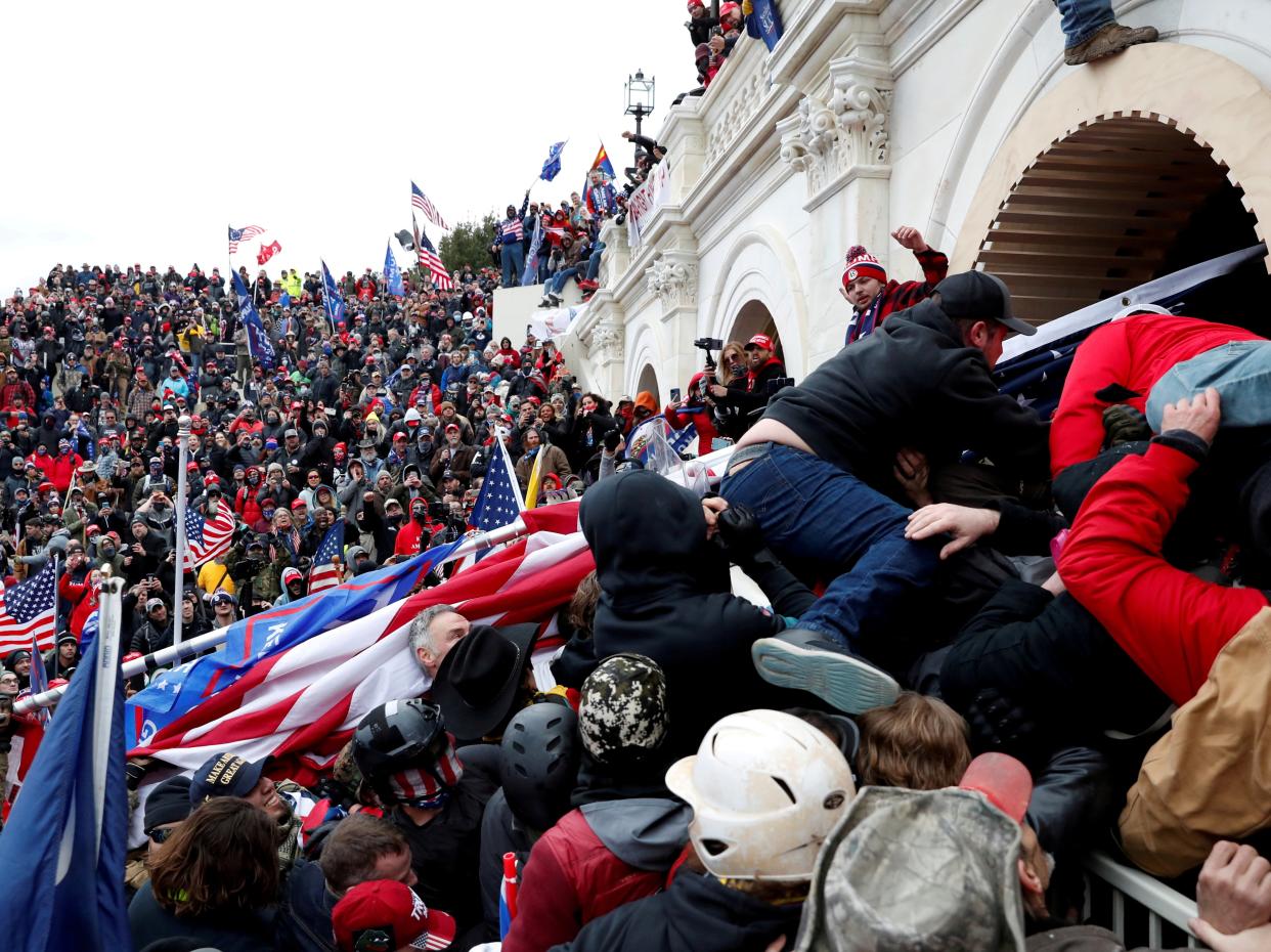 <p>Pro-Trump protesters storm into the US Capitol during clashes with police, during a rally to contest the certification of the 2020 presidential election results</p> (REUTERS)