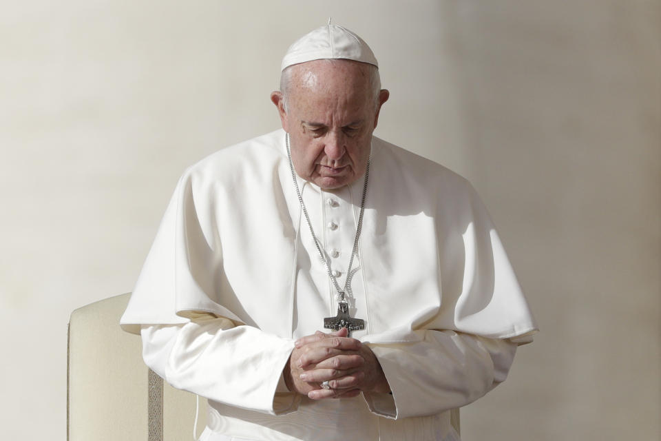 Pope Francis prays during his weekly general audience, in St. Peter's Square, at the Vatican, Wednesday, Nov. 27, 2019. (AP Photo/Andrew Medichini)