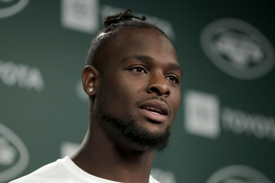 New York Jets running back Le'Veon Bell speaks to reporters at the team's NFL football training facility in Florham Park, N.J., Tuesday, June 4, 2019. (AP Photo/Julio Cortez)