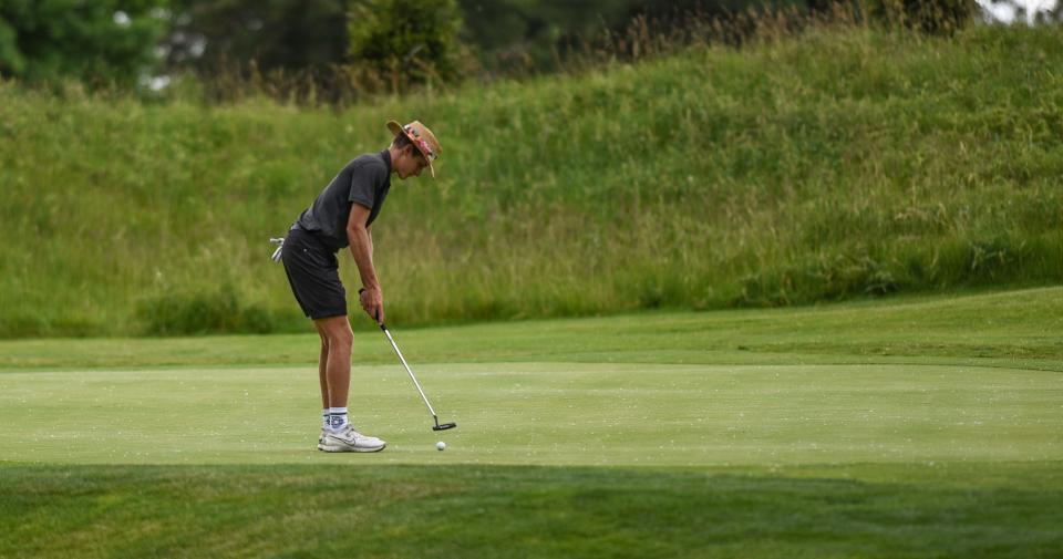 Baylor Brogan of Lansing Christian putts Friday, June 10, 2022, during the MHSAA Div. 4 Golf State Final at Forest Akers West in East Lansing.