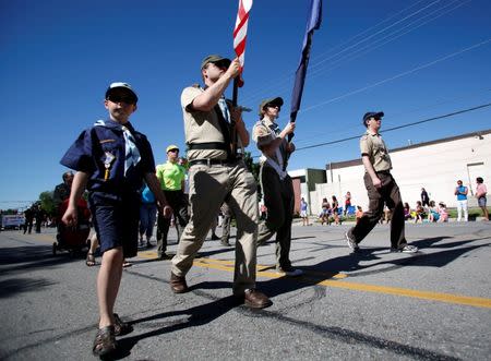 FILE PHOTO - Active Mormons and members of the Boy Scouts of America march in a gay pride parade with members of LGBT community and their supporters as part of the Utah Pride Festival in Salt Lake City, Utah, U.S. on June 2, 2013. REUTERS/Jim Urquhart/File Photo