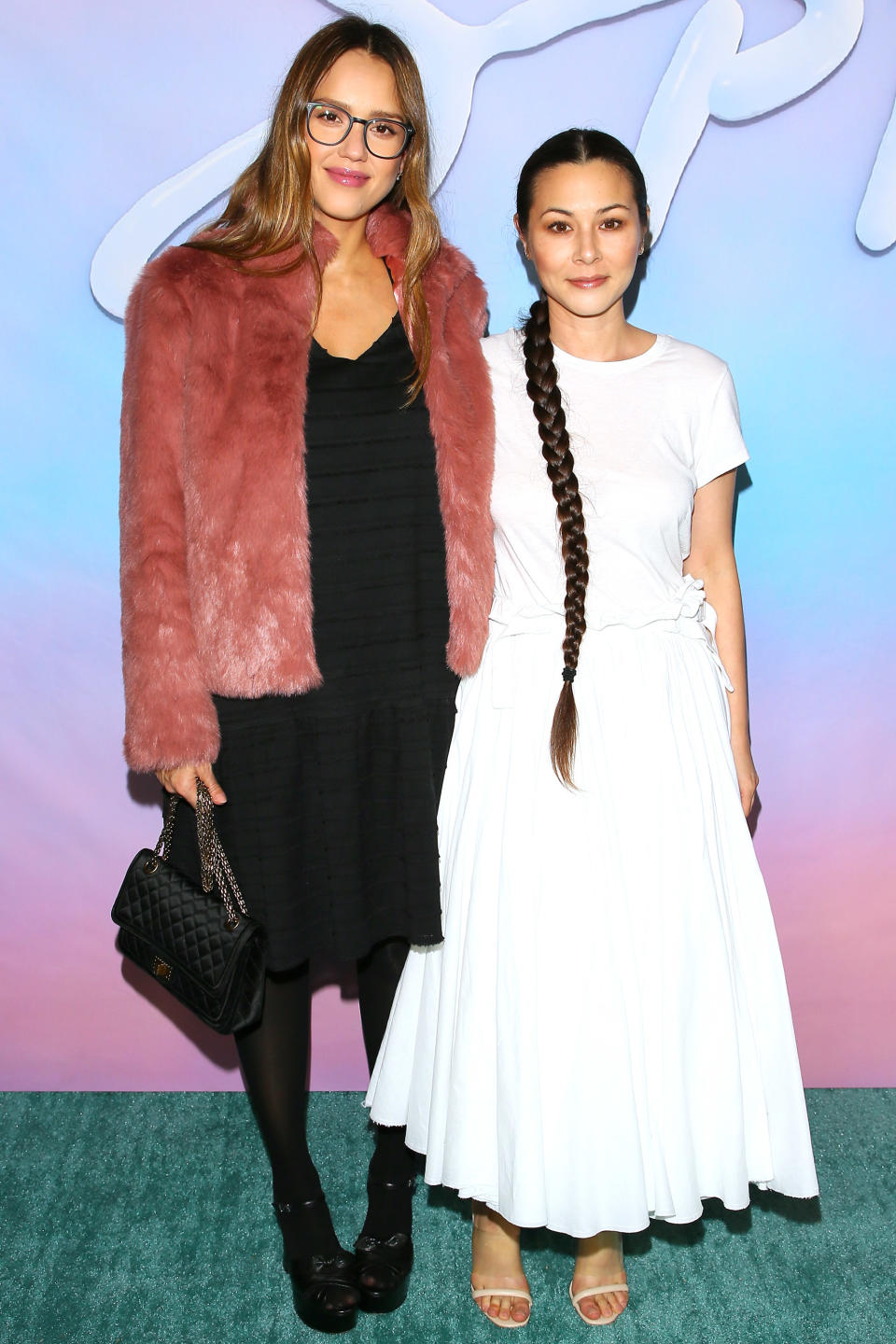 <p>Alba arrived at the L.A. premiere of <em>SPF-18</em> in a rose-colored fur coat, a ribbed LBD, black tights, and Saint Laurent leather platform sandals ($895; <a rel="nofollow noopener" href="https://www.luisaviaroma.com/en-us/p/saint-laurent/women/sandals/65I-G5D012" target="_blank" data-ylk="slk:luisaviaroma.com;elm:context_link;itc:0;sec:content-canvas" class="link ">luisaviaroma.com</a>). The expectant mom accessorized with a classic quilted handbag and oversize glasses. </p>