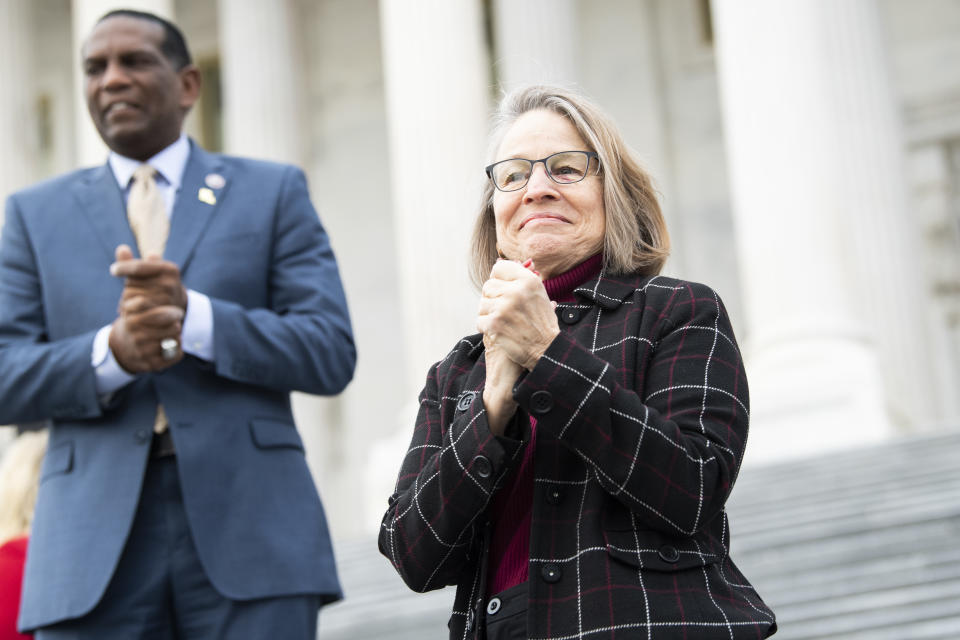 Reps. Mariannette Miller-Meeks, R-Iowa, and Burgess Owens, R-Utah, are seen during a group photo with freshmen members of the House Republican Conference on the House steps of the Capitol on January 4, 2021. (Tom Williams/CQ Roll Call via Getty Images)