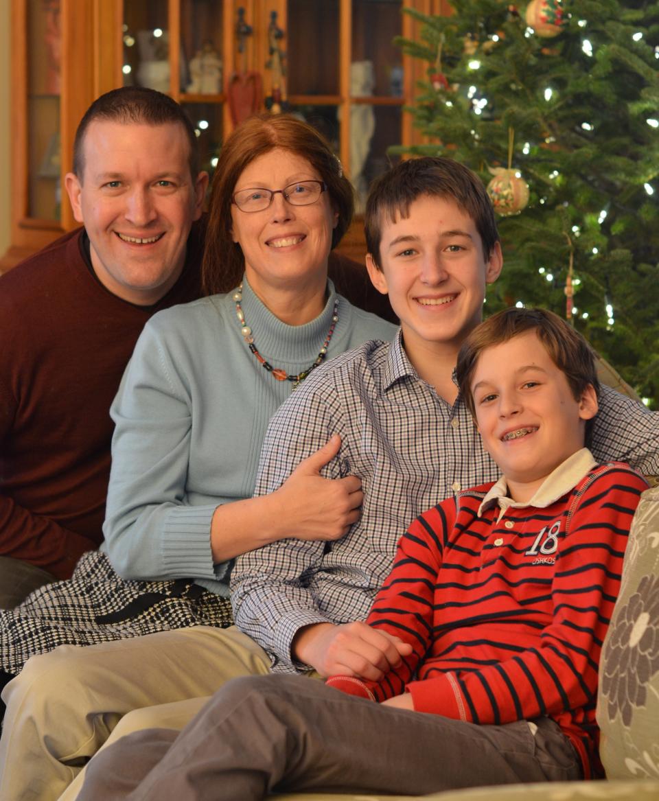 Music teacher Hanna Powell is pictured with her husband Andy and their two sons Patrick and Jonathan.