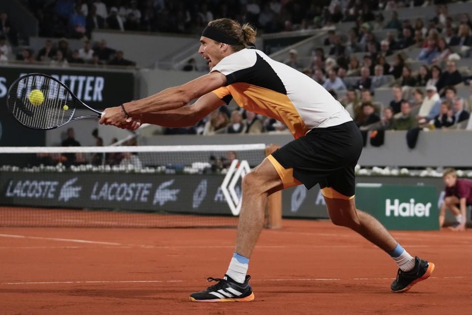 Germany's Alexander Zverev plays a shot against Denmark's Holger Rune during their fourth round match of the French Open tennis tournament at the Roland Garros stadium in Paris, Monday, June 3, 2024. (AP Photo/Thibault Camus)