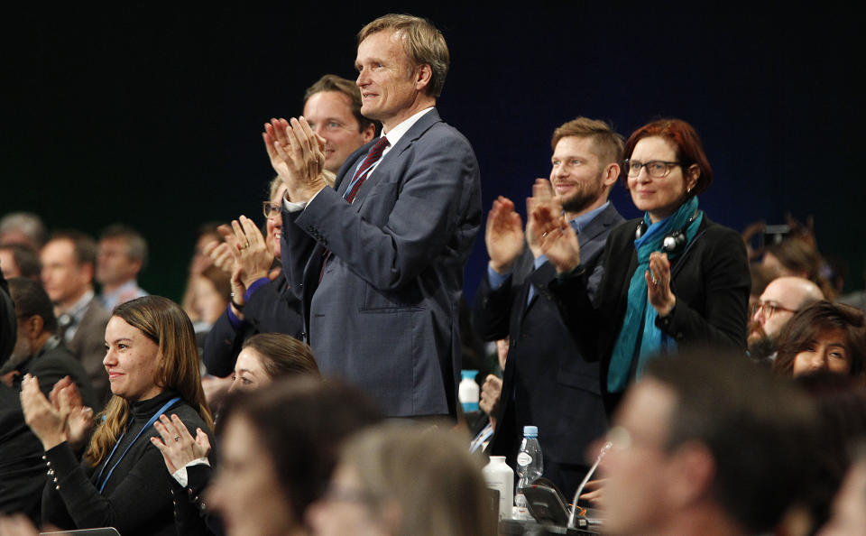 Karsten Sach ,center, head of the German negotiating eelegation, react to the decision of the compromise at the World Climate Summit in Katowice, Poland, Saturday, Dec. 15, 2018. (AP Photo/Czarek Sokolowski)