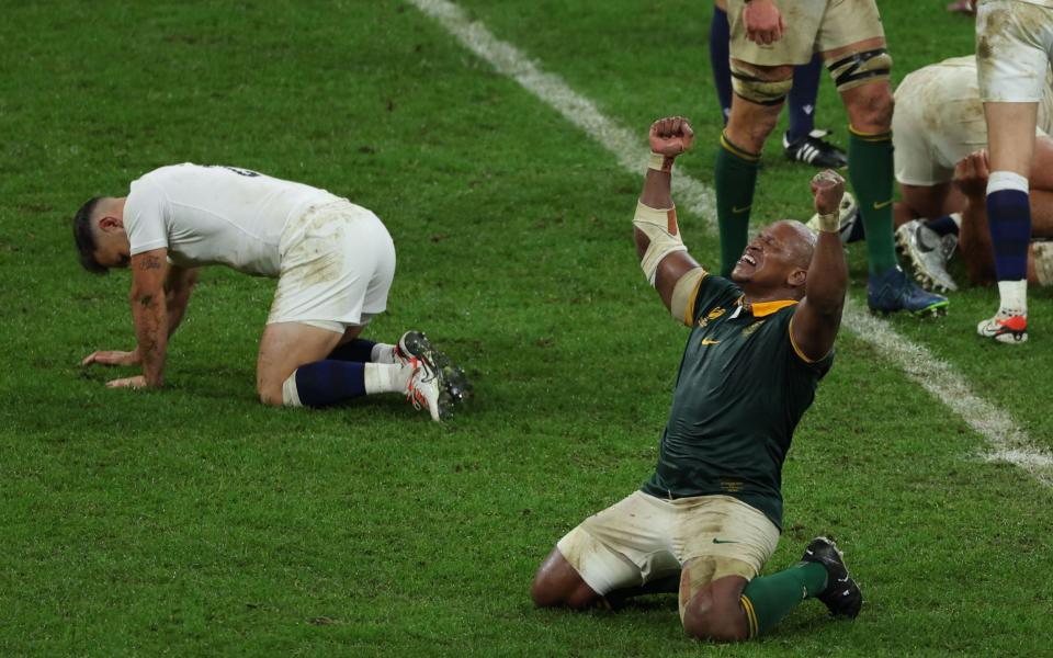 South Africa's hooker Bongi Mbonambi falls to his knees after the final whistle