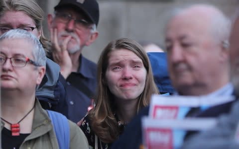 A woman reacts during a vigil in Dublin for murdered journalist 29 year-old Lyra McKee - Credit: Niall Carson/PA