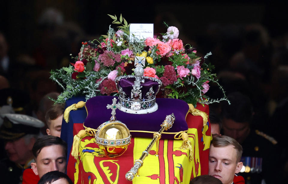 The coffin of Queen Elizabeth II is carried out of the Westminster Abbey.<span class="copyright">Hannah McKay—Pool/Reuters</span>