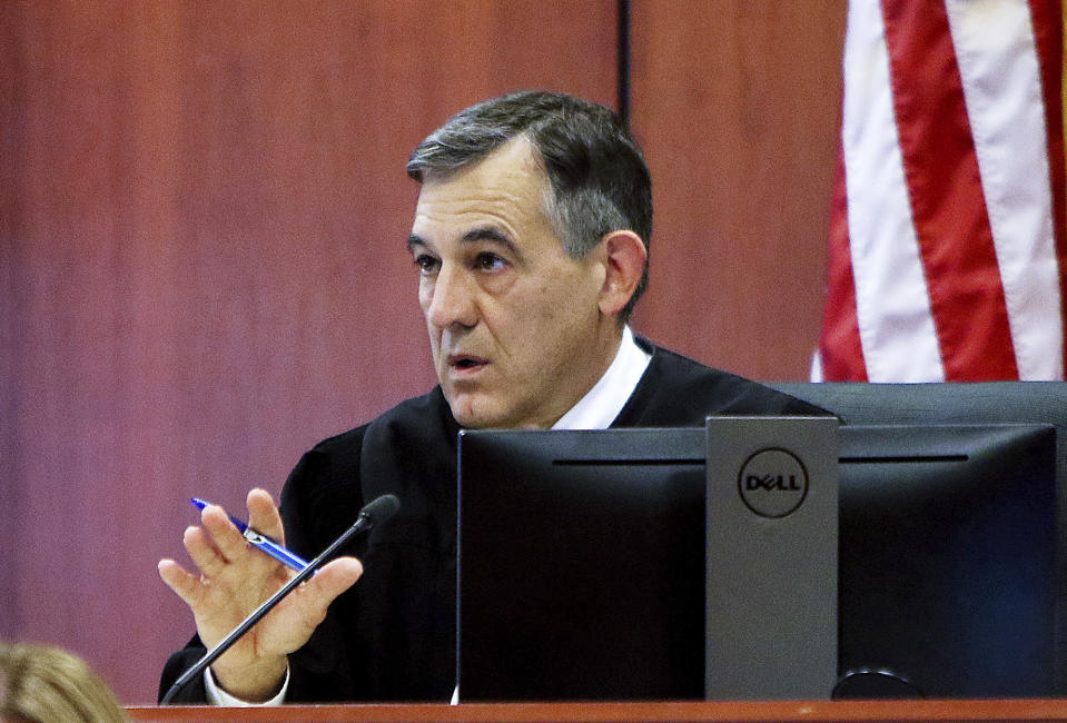 District Judge Michael Reardon speaks to attorneys during the second day of testimony in the rape trial of former Idaho state Rep. Aaron von Ehlinger at the Ada County Courthouse, Wednesday, April 27, 2022, in Boise, Idaho. (Brian Myrick/The Idaho Press-Tribune via AP, Pool)