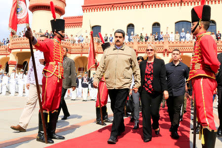 Venezuela's President Nicolas Maduro and his wife Cilia Flores attend a ceremony to commemorate the sixth anniversary of the death of Venezuela's late president Hugo Chavez at the 4F military fort in Caracas, Venezuela March 5, 2019. Miraflores Palace/Handout via REUTERS