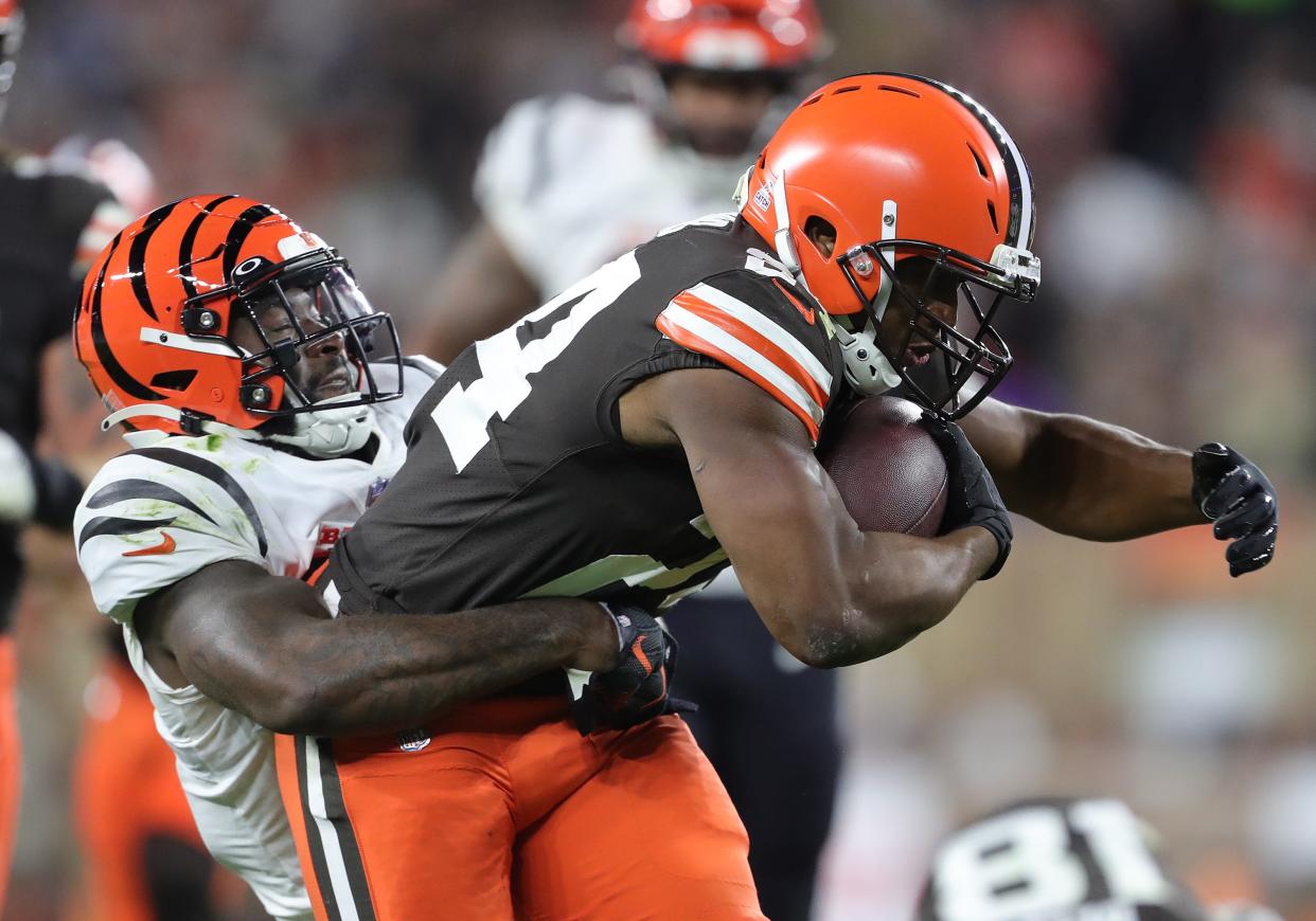 Browns running back Nick Chubb is brought down by Bengals linebacker Germaine Pratt during the first half Monday, Oct. 31, 2022, in Cleveland.