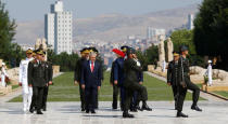 Turkey's Prime Minister Binali Yildirim, flanked by Chief of Staff General Hulusi Akar (2nd L) and the country's top generals, attends a wreath-laying ceremony in Anitkabir, the mausoleum of modern Turkey's founder Mustafa Kemal Ataturk, ahead of a High Military Council meeting in Ankara, Turkey, July 28, 2016. REUTERS/Umit Bektas