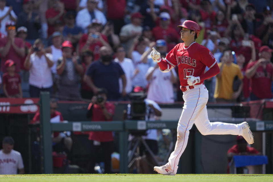 Los Angeles Angels designated hitter Shohei Ohtani (17) runs the bases after hitting a home run during the ninth inning of a baseball game against the Chicago White Sox in Anaheim, Calif., Thursday, June 29, 2023. Mike Trout also scored. (AP Photo/Ashley Landis)