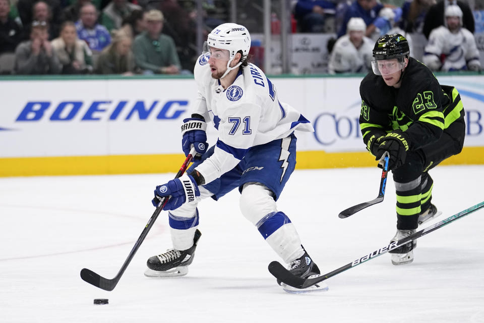 Tampa Bay Lightning center Anthony Cirelli (71) saktes to the net, scoring on the attack after getting past Dallas Stars defenseman Esa Lindell (23), in the second period of an NHL hockey game, Saturday, Feb. 11, 2023, in Dallas. (AP Photo/Tony Gutierrez)