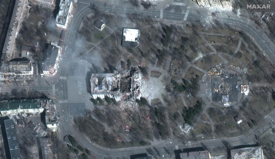 Imagery from Maxar Technologies shows a destroyed Mariupol Drama Theater, a place civilians were using as shelter and wrote the Russian word for children in front of and behind the theater.