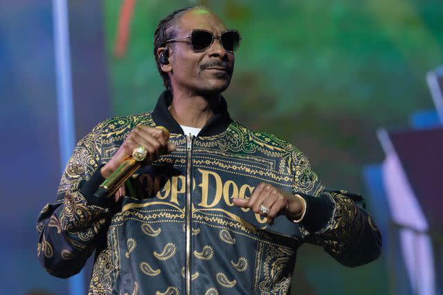 <p>Andrew Chin/Getty </p> Snoop Dogg performs in Vancouver in July 2023