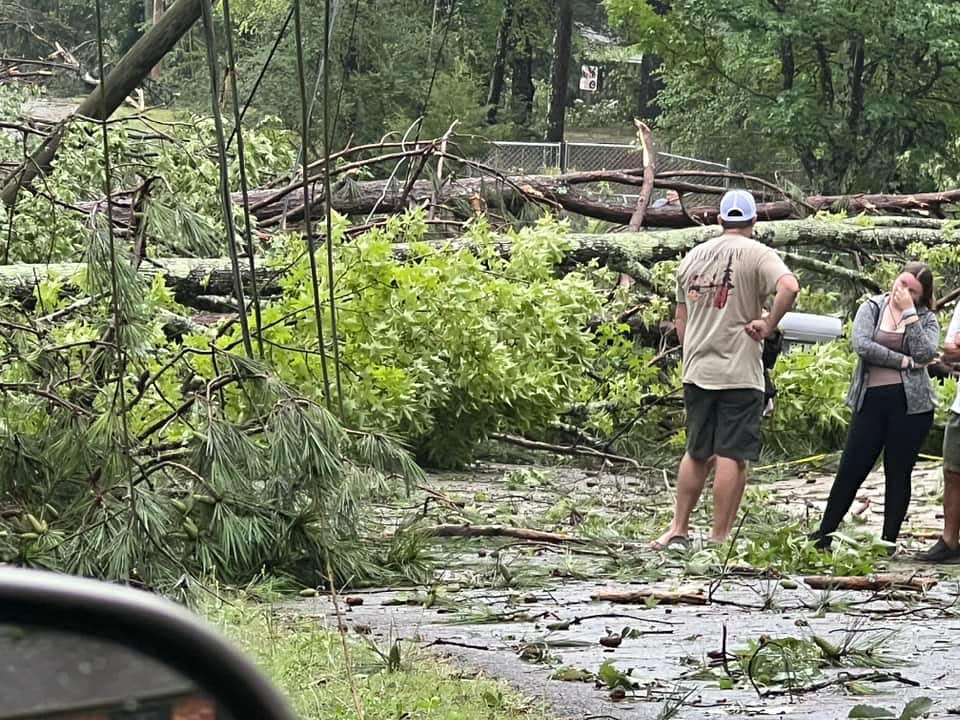 People survey some of the damage on Church Street from the storm that hit the Lookout Mountain area in Gadsden on Aug. 3.
