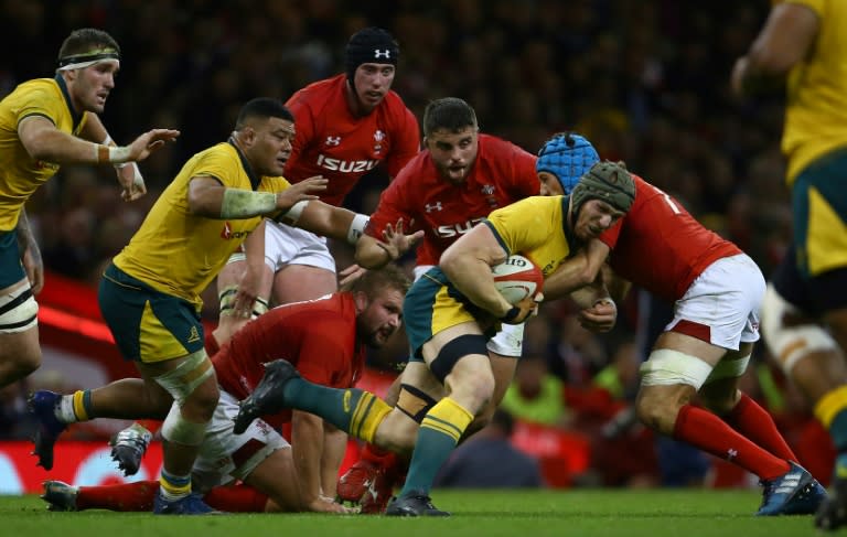 No way through: Wales flanker Justin Tipuric tackles Australia flanker Michael Hooper