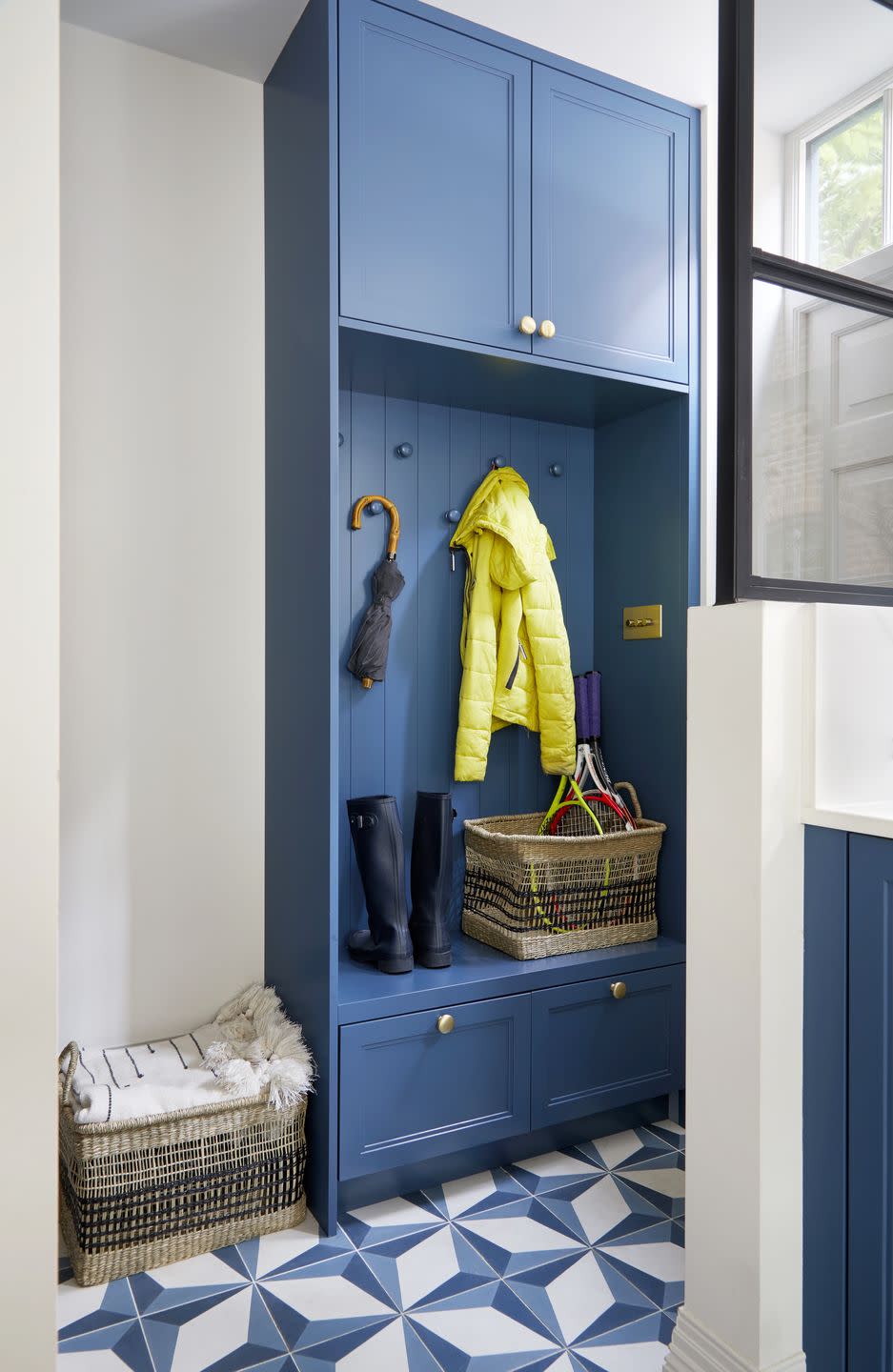 a boot room closet with clothes