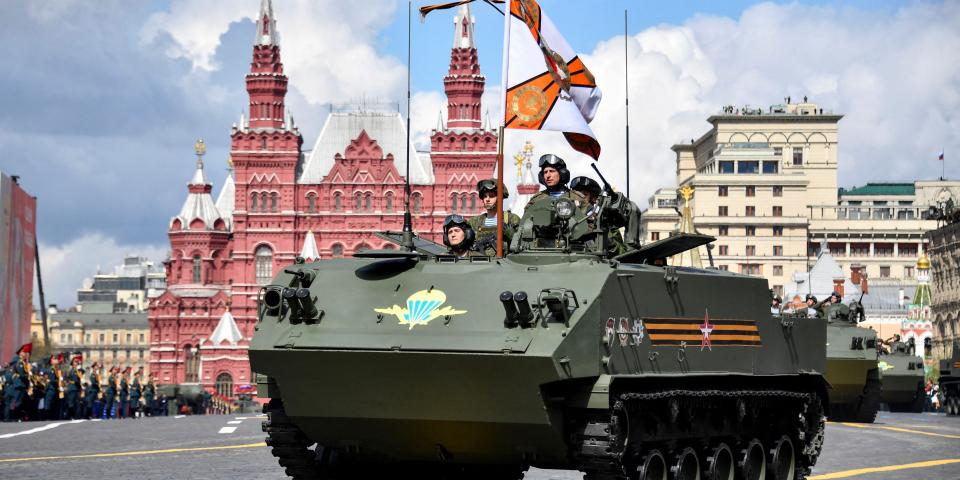 Russian servicemen, who took part in Russia's military action in Ukraine, ride BTR-MDM Rakushka airborne armored personnel carriers during the Victory Day military parade at Red Square