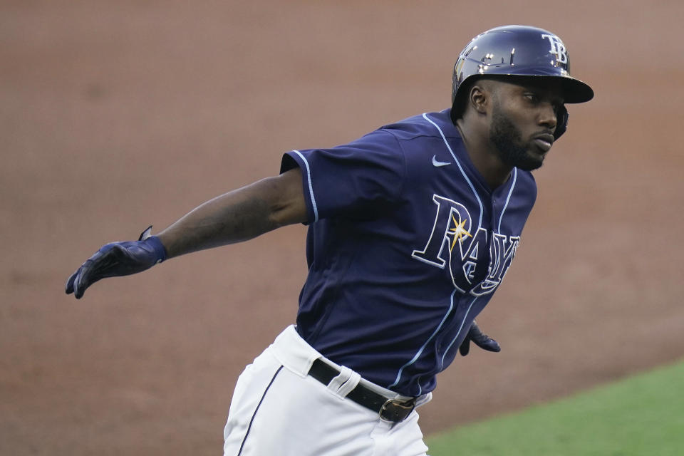 Tampa Bay Rays designated hitter Randy Arozarena reacts as he rounds the bases after hitting a solo home run against the New York Yankees during the first inning in Game one of a baseball American League Division Series Monday, Oct. 5, 2020, in San Diego. (AP Photo/Jae C. Hong)