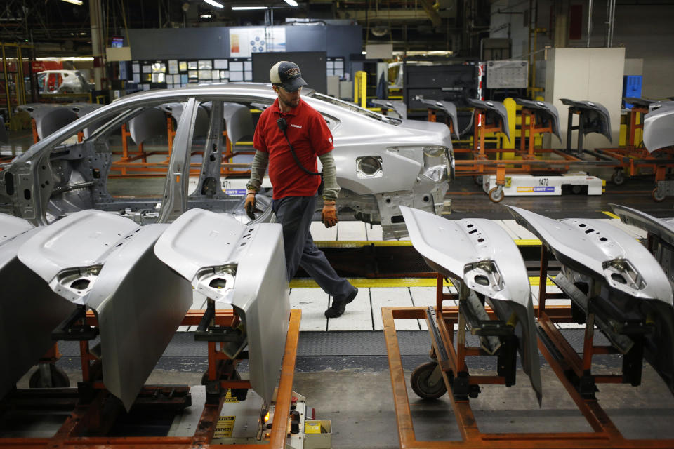 A worker inspects parts for vehicle frames on the assembly line at the Nissan Motor Co. manufacturing facility in Smyrna, Tennessee, U.S., on Tuesday, Oct. 31, 2017. Nissan Motor Co. is scheduled to release earnings figures on November 7. Photographer: Luke Sharrett/Bloomberg