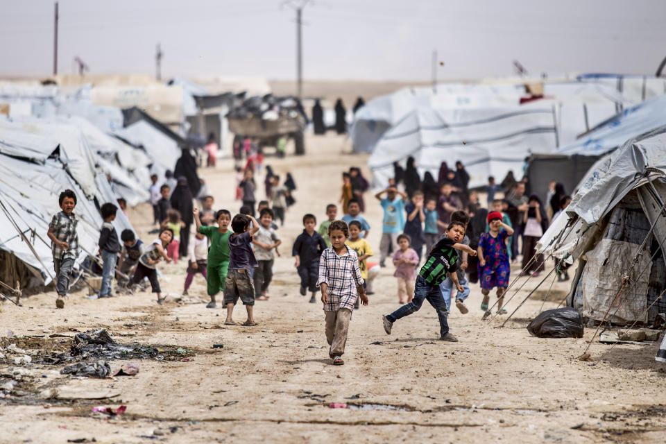 Children gather outside their tents, at al-Hol camp, which houses families of members of the Islamic State group, in Hasakeh province, Syria, on May 1, 2021. (Baderkhan Ahmad / AP file)
