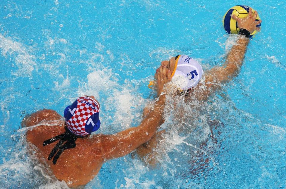 Water polo players have their toenails checked before competition.