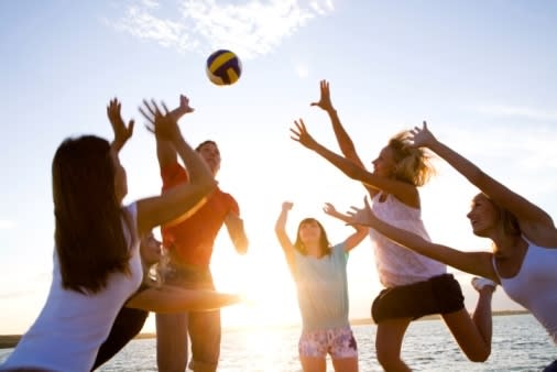 Women playing volleyball