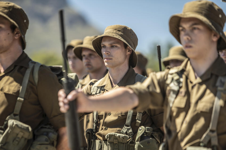 This image released by IFC Films shows Kai Luke Brummer, center, in a scene from "Moffie." (IFC Films via AP)