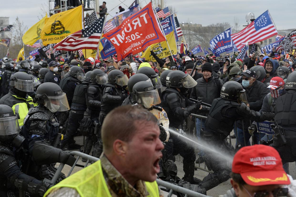 Trump supporters clash with police and security forces as people try to storm the US Capitol in Washington D.C on January 6, 2021. Demonstrators breeched security and entered the Capitol as Congress debated the 2020 presidential election Electoral Vote Certification.