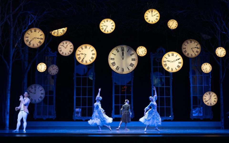 Playing Cinderella, Michelle Katcher, center, turns back to ragged clothing as the clocks strike midnight after meeting her prince at the ball, played by Victor Maguad, left, during a Sacramento Ballet dress rehearsal on Thursday at the SAFE Credit Union Performing Arts Center. Lezlie Sterling/lsterling@sacbee.com