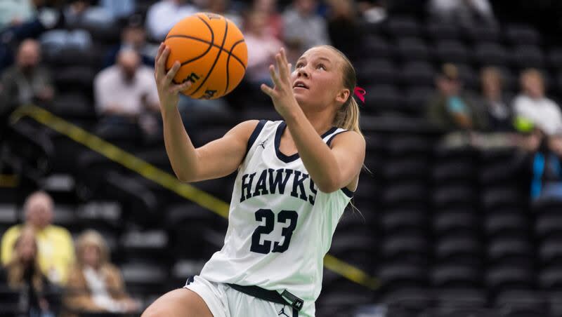 Ridgeline Riverhawks guard Elise Livingston (23) jumps for a layup during the 4A girls basketball state semifinals against the Payson Lions at the UCCU Center in Orem on Tuesday, Feb. 27, 2024.