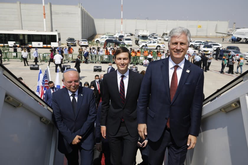 Israeli National Security Advisor Meir Ben-Shabbat, left, U.S. President Donald Trump's senior adviser Jared Kushner, center, and U.S. National Security Advisor Robert O'Brien, right, board the Israeli flag carrier El Al's airliner as they fly to Abu Dhabi for talks meant to put final touches on the normalization deal between the United Arab Emirates and Israel, at Ben-Gurion International Airport, near Tel Aviv, Israel Monday, Aug. 31, 2020. (Nir Elias/Pool Photo via AP)
