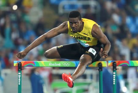 2016 Rio Olympics - Athletics - Preliminary - Men's 110m Hurdles Round 1 - Olympic Stadium - Rio de Janeiro, Brazil - 15/08/2016. Deuce Carter (JAM) of Jamaica competes. REUTERS/Lucy Nicholson
