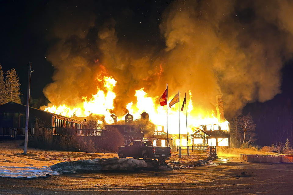 Smoke Flames engulf Lutsen Lodge as an overnight blaze destroyed the historic lodge, early Tuesday, Feb. 6, 2024, in Lutsen, Minn. (Edward Vanegas via AP)