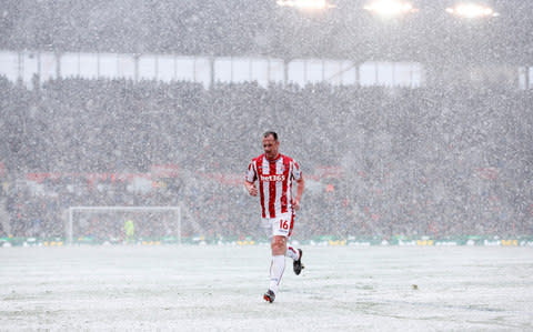 Adam trudges off in the snow - Credit: Reuters