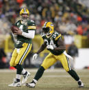 File-This Jan. 20, 2008, file photo shows Green Bay Packers quarterback Brett Favre (4) dropping back to pass with Vernand Morency (34) blocking during the NFC Championship football game in Green Bay, Wis. Members of a special panel of 26 selected all of them for the position as part of the NFL's celebration of its 100th season. All won league titles except Marino. All are in the Hall of Fame except Brady and Manning, who are not yet eligible. On Friday, Dec. 27, 2019, quarterback was the final position revealed for the All-Time Team. (AP Photo/Mike Roemer, File)