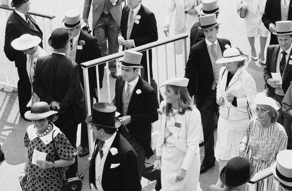 FILE - In this June 19, 1985, file photo, Prince Andrew walks with Sarah Ferguson at the Royal Ascot racing meeting, near London. (AP Photo/David Caulkin, File)